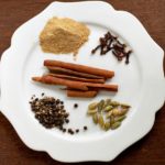 White plate with piles of spices