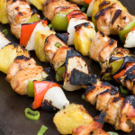 Chicken Kebabs with peppers and onions on a cookie sheet