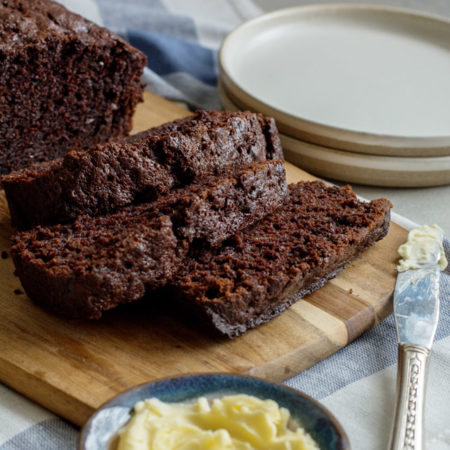 Three slices of chocolate loaf laying one on top of the other.