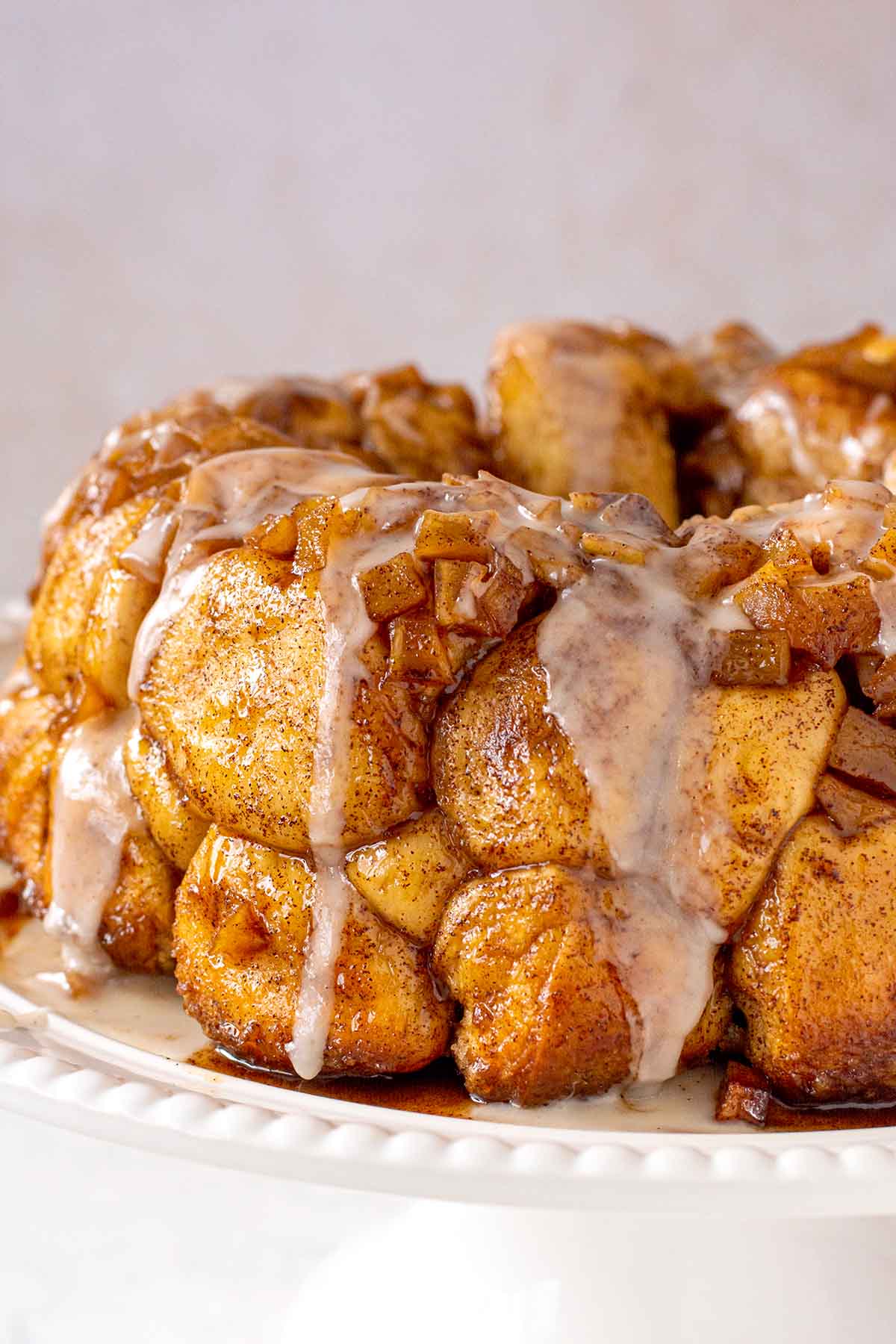 Close up shot of the monkey bread with the glaze and caramelized apples.